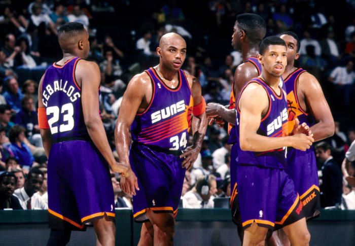 Phoenix Suns forward Charles Barkley (34), Cedric Ceballos (23), Kevin Johnson (7), Oliver Miller and A.C. Green wait during a time-out against the Dallas Mavericks at Reunion Arena during the 1993-94 season.
